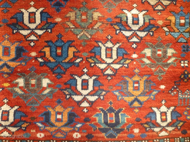 Pretty little 19th century kazak. Great colours and design. Losses to sides and edges. Couple of patches at back where rug is worn. Size 47 inches by 34.     