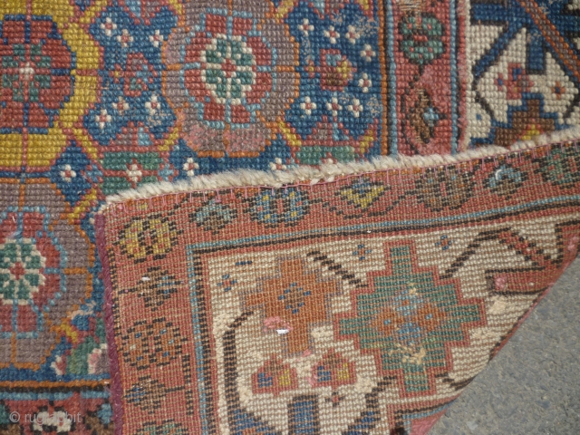 19th century Kurdish/NW Persian runner. Needs a good clean. Edges secured. Bit of a cut at one end. Some wear. Sensibly priced. Photos taken on a very bright day so a little  ...