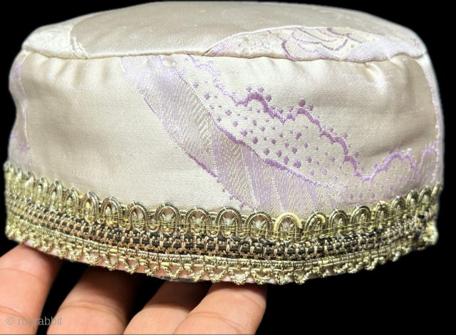 Antique traditional silk brocade and metallic embroidered child skullcap. İt has a plain cotton. İt is in great condition. Size : 2.5'' x 17'' - Height : ''7 cm x Circumference :  ...