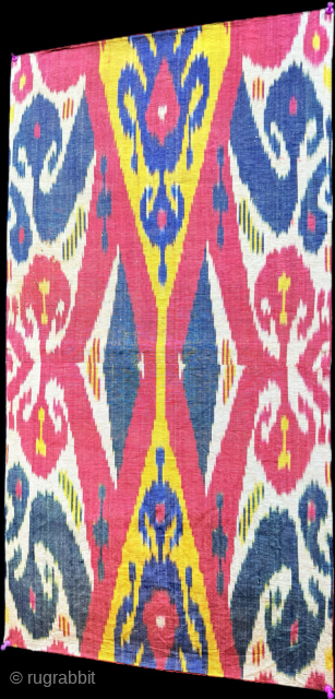 Antique Uzbekistan silk adras ikat fragment. Amazing saturated colors from natural dyes. It has plain fine red cotton backing. Fairly in good condition. Size - 30.5'' x 16'' - ''77 cm x  ...