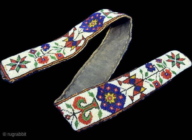 Anatolian glass beaded antique belt. It has original leather backing. Fairly in good condition. Circa - 1920 - 30s. Size : (29.5'' x 2'') - (''75 cm x 5 cm'') turkmansilver@gmail.com.