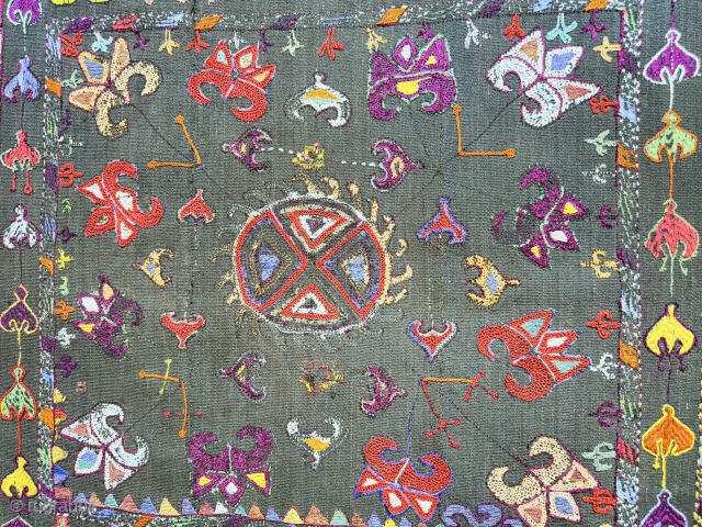 Tajikistan Kungrat silk embroidered mirror cover. Saturated natural colors with traditional lakai, Kungrat zoomorphic motifs. Russian printed cotton fabric backing and silk tassels.