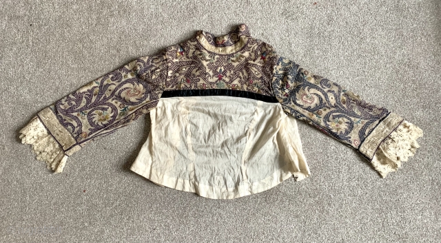  a lovely 18 c Algerian Tanchifa (wedding shawl ) made into a bodice in France some time in the 19 c.  Really good embroidery with great colours size 110 x  ...