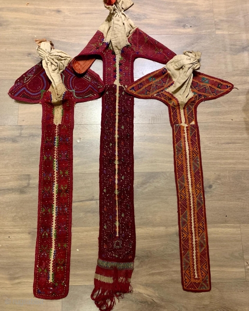 a small collection of 3 rare antique Kyrgyz long tale hats.  The middle one has beautiful ikat lining and complex silk end finish other two have Russian roller print lining.   ...