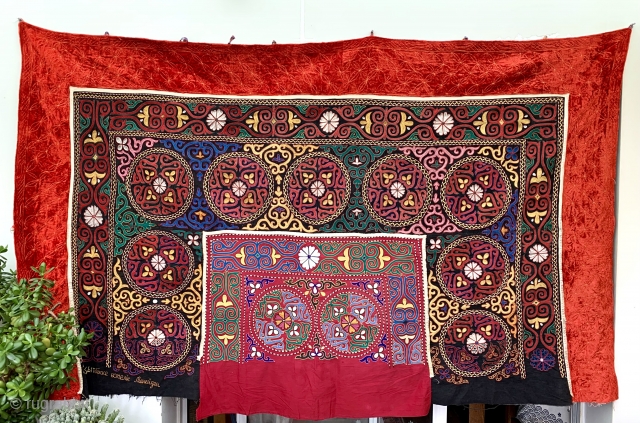 this is a lovely old Tush Kyiz embroidered yurt decoration from Kyrgyzstan.  Size 237 x 145 cm dating from mid 20 c or a bit before so 70 + years old.  ...