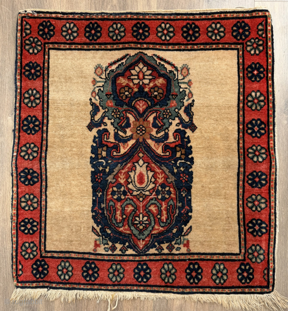 a small antique Persian Sarouk poshti ( cushion cover) piled rug ca 1920 s size 55 x 52 cm. Excellent condition it has been hanging ( rings still attached) ...
