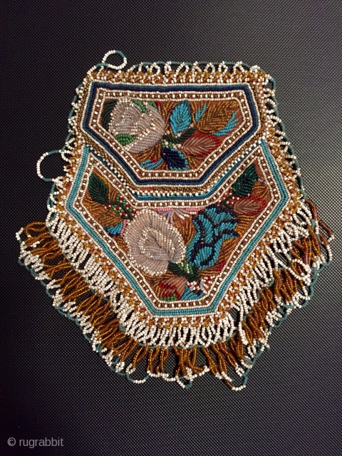 Charming antique American Indian beadwork purse the finest of this type I have seen.
Late 19 c in excellent condition including the satin lining with small pocket       