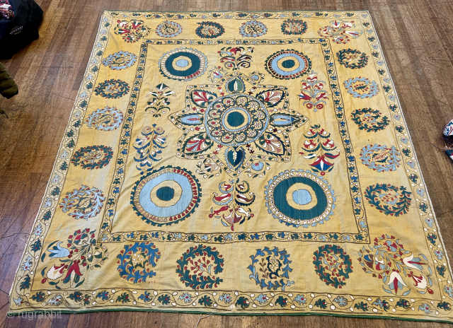 antique yellow ground suzani 234 x 202.   Very decorative and excellent condition just slightly faded  down very outer edges.  Original chintz backing has holes.  Large size would  ...