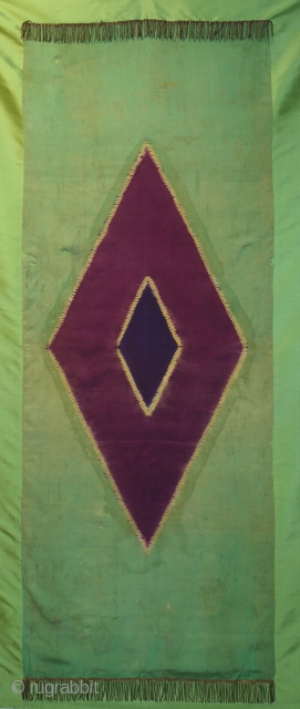 antique Lawon textile from Indonesia resist dyed silk size 184 x 68 cm.  Mounted on green silk can be put on wooden stretcher. Small holes and stains, there is a shadowy  ...