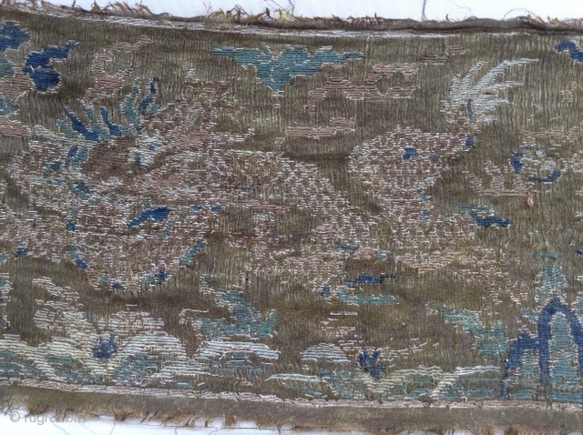 Very old silk textile from Tibet. Two Dragons, in the middle may be the holy mountain Kailash.
It is extrem fine.             