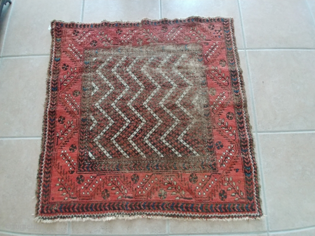 Rare piled Baluch Soffreh or Ru-Korsi with an unusual border. A bit battered but yet collectible. 41 inches square or 104cm square.  If you click on Anthony Fahmie's pages link found  ...