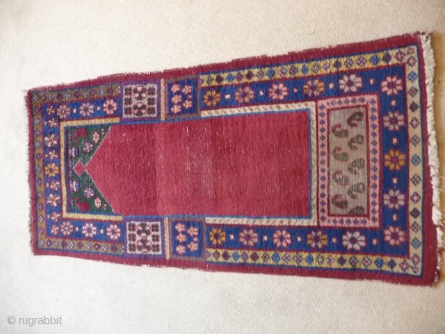 KHOTAN ;  An unusual Khotan prayer rug, complete and in reasonable condition.
SOLD                    