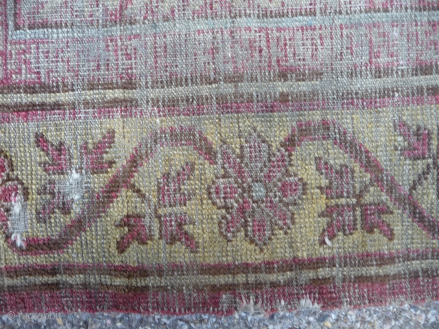 Ancient ethereal Khotan rug with an unusual design, complete and in ghostly condition.                    