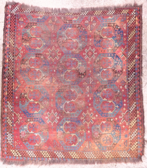  Exceptional ERSARI main carpet; 18th cent. Unique gul and main border design.Fragmented, worn and stained.  6ft 2ins x 5ft 10ins.

SEE IT AT KARMA        