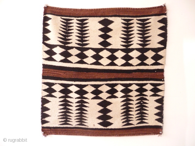 Navajo , very pretty and striking early 20th cent. saddle rug , good condition ,from an English collection, 2ft 5in x 2ft 4in.SOLD          