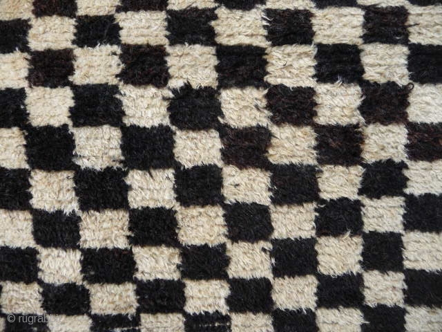  SOLD  Tibetan checkerboard rug, collected in Tibet in the early 20th c. interesting provenance, small damage to two corners otherwise good condition,5ft3in x 2ft11in.       