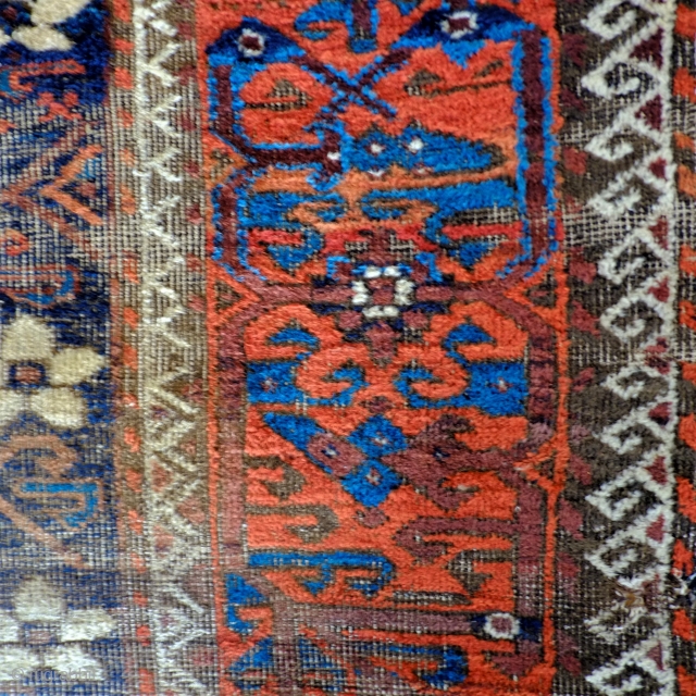 An early Mina Khani Persian Baluch Rug 
Size 215 x 91 cm
In distressed fragmented condition with wonderful colours, including an electric blue and aubergine brown and dating from the mid 19th century.  ...