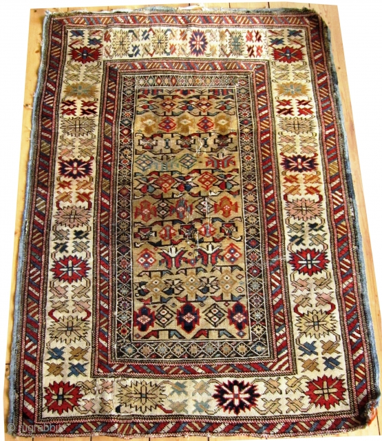  
A  19th/20th Century Yellow Ground Shirvan (Kuba) Rug 
Size 97 x 142 cm

With pastel coloured 'crab border', in fair overall condition with evenly worn pile, foundation warps are visible in  ...