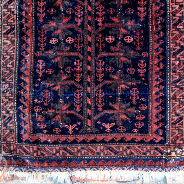 A 19th Century Baluch Balisht
Size 92 x 57 cm

With very silky wool and subdued colours this probably quite an early piece. In overall fair to good condition, with a small repair to  ...