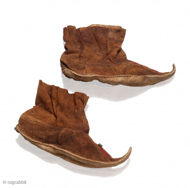 Ladies Leather Boots, Saka or Wusun Nomads of Central Asia, 5th century BCE – 2nd century CE, with raised toecaps, silk embroidery, green glass bead. L. 22 cm; H. 14 cm. Published:  ...