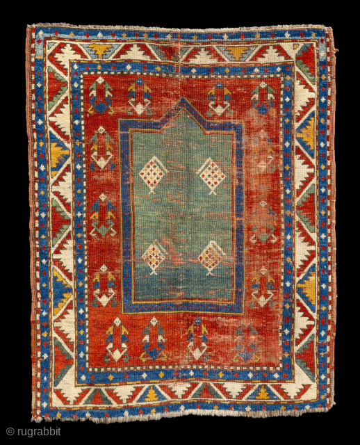 A gem from the collection of Pulitzer Prize-winning author and poet Peter Balakian. A rare and beautiful Fachralo Kazak circa 1880s or earlier. 3'5" x 4'2", unusual green mirhab with 4 botehs,  ...