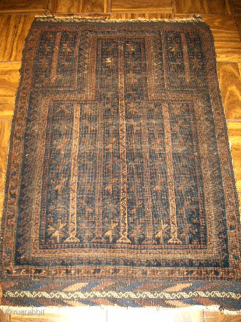2'10"x 4'3" Belouch "Dokhar Ghazi" prayer rug of 100% wool loomed on wool.  First quarter twentieth century finely knotted showing overall wear and a small hole in the "mihrab" area (see  ...
