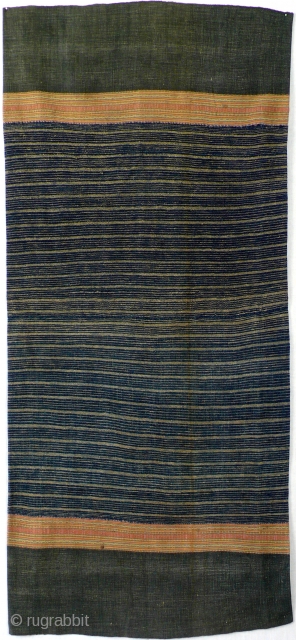  Woman's skirt, handwoven, Thailand, ca. 1950

Handspun, handwoven cotton, indigo dyed, 4 panels, minimalistic design with plain off white stripes, complementary warp stripes in light colours on both sides.

Condition: slightly faded, some  ...