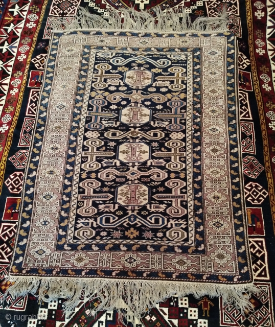 Antique Kuba Perepedil rug. Size 105x165cm. Holes pictured, other than in very good condition. Some synthetic color.                