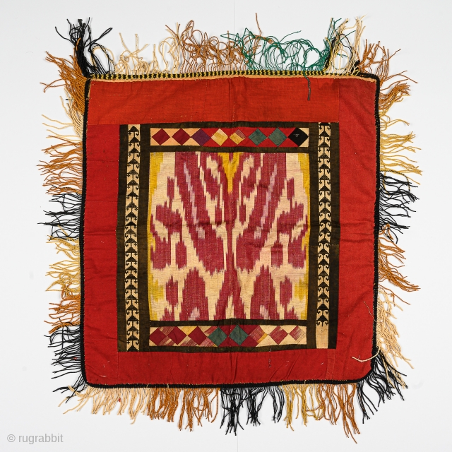 A mirror cover from Uzbekistan with ikat. Cm 44 x 49.                      