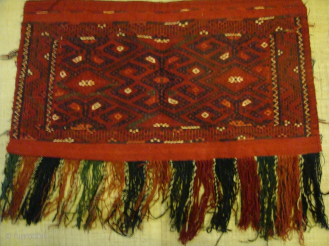 Early 20th Century Yamoud Turkmen Torba (Shallow Tent Bag). All Wool. Front face only, without backing. Design: The distinctive "Bastani" Gul of the Yamoud Clan.
Dimensions: Horizontal: Approx.78cm. Vertical: Approx.42cm. Fringe(V): Approx.20cm.  