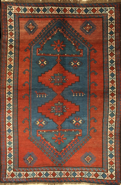 Antique Kazak Mehrabli rug with camel motives, Tovuz district, Azerbaijan, c1900. Size: 140x200cm (4'7"x6'6"). Brown and ivory wool warps twisted and soft red wool wefts. Good original condition. No repairs. All good  ...