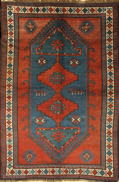 Antique Kazak Mehrabli rug with camel motives, Tovuz district, Azerbaijan, c1900. Size: 140x200cm (4'7"x6'6"). Brown and ivory wool warps twisted and soft red wool wefts. Good original condition. No repairs. All good  ...