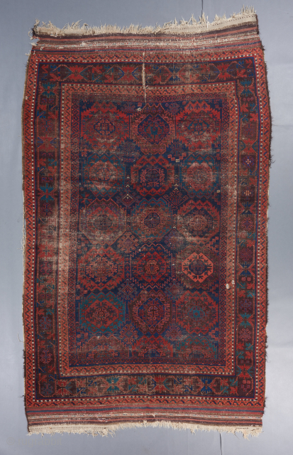A very old baluch main carpet. 10'3" x 6'4". condition issues as visible. Ask for more details.                