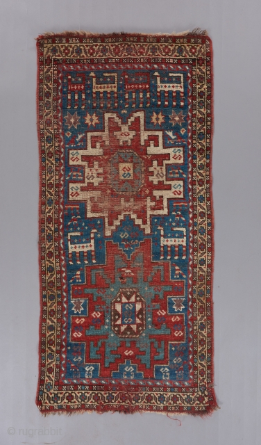 Lovely little caucasian rug. Red and brown wefting. 4'10" x 2'4".                      