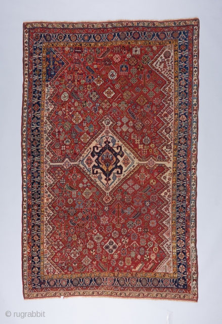 Fine Qashqai Kashkuli with very good color and age. Low pile all around. One outer end border rewoven. 7'8" x 4'11"            