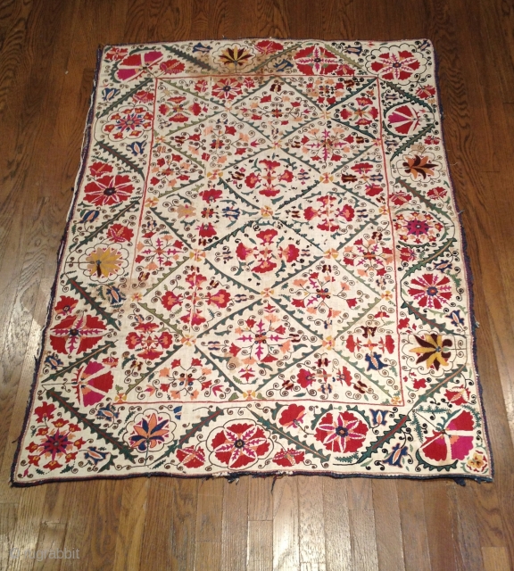 Very pretty early 19th century Suzani with wonderful colors. Has stains but in decent condition otherwise. 4'9" x 3'2'.              