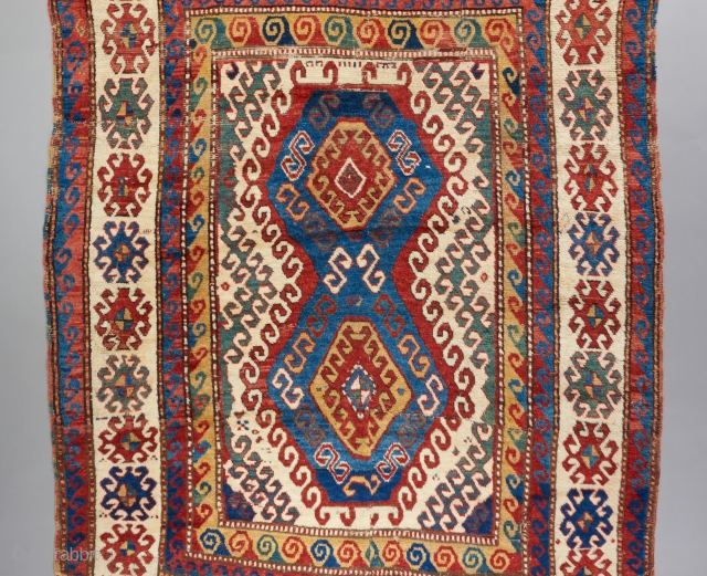 Kazak with very good age. Great bold color and design that we all love too see in this type. 7'9" x 5'3". Great pile in some places. Cut and reattached in a  ...