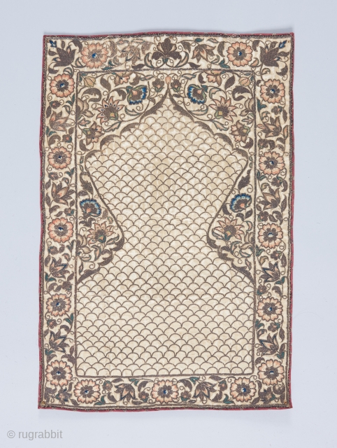 Diminutive prayer textile. Silk and metal embroidery with Ikat back. Superbly executed and delicate piece of work. Probably a late Safavid piece. 1'9" x 1'2".        