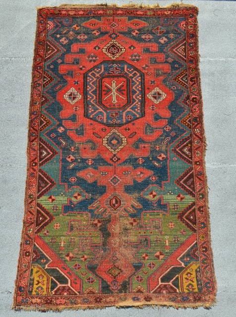 Kurdish Rug. Very Unique and bold design. The color variation simply pulls you in.
Some wear and tear but it doesn't obscure the power of the drawing. Some glue on the back. 19th  ...