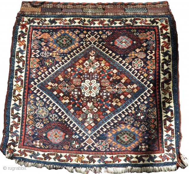 Qashqai bagface, very soft and fluffy wool with nice colors. Persian knot open left. Colorful flatwoven fasteners preserved at top, nice pile.           