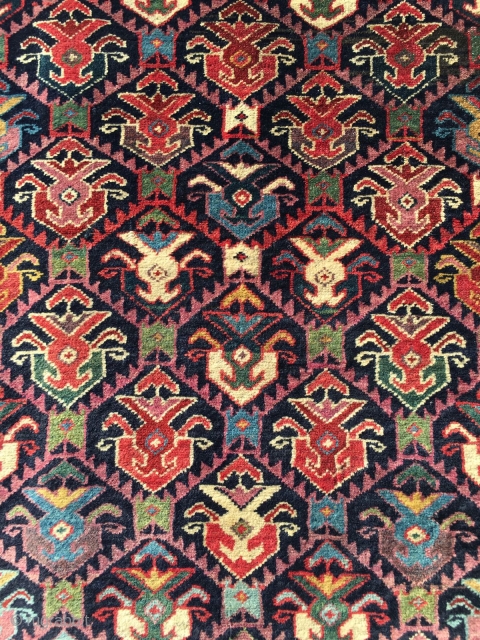 Mid 19th century northwest runner . Spectacular colors . Wool warps and cotton wefts. Cut at one end . A few small tears . App. 10' x 3'.     