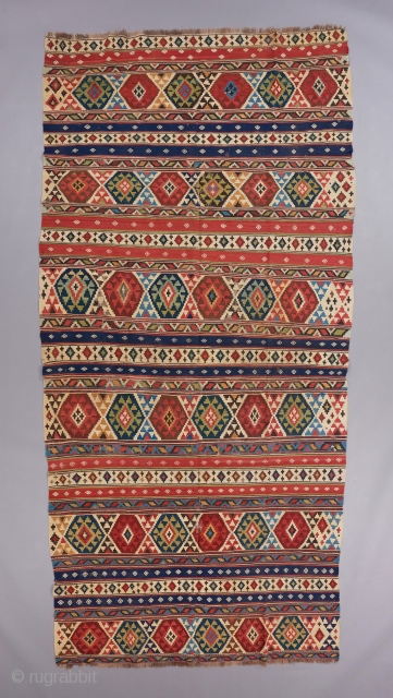 Caucasian Kilim. Superb color, a great and old one of its type. It has some embroidered little motifs in the blue and red stripes. 11' x 5'4". Wear and tear. 

Visit our  ...