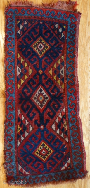 Uzbek Napramach cradle rug. 34 x 14 inches. Mostly medium to low pile. A few knots worn down. Minor edge and end loss. See www.banjaratextiles.com for more rugs and textiles.
   
