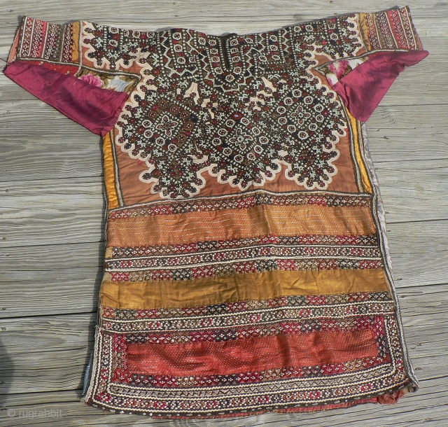 Superb Old Sind Wedding Choli. This spectacular heavily embroidered dress or choli from the Sind region was probably made and used by a bride in her wedding. The choli is fully embroidered  ...