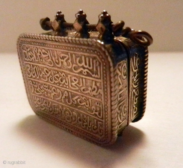 Koran Box with Inscription of Koranic Verses

A rare Koran box worn as a amulet pendant.
The inscription of Koranic verses are in TUGHRA form and are reposed .Box is provided with four delicate  ...
