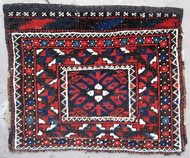 Very unusual Baluch bagface. Small format, almost like a chanteh. All good colors and very good condition. More age than may appear. I think late 19th century. The kilim design at the  ...