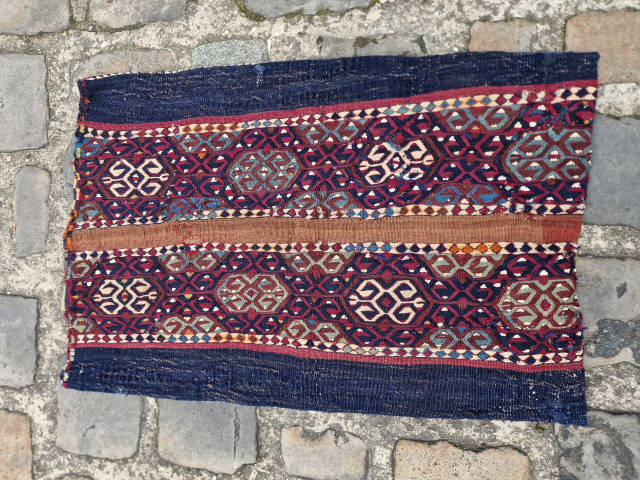 A clothing storage bag woven with the sumac technique, dating back to approximately 1880.  A completely natural dyes technique and a sweet artistic look.  From the Kurdish nomadic life in  ...