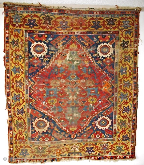 Kula type rug, (or at least it appears so at first glance) Intensely saturated colors including two yellows, at least three blues and four greens. Lots of lazy lines. The border is  ...