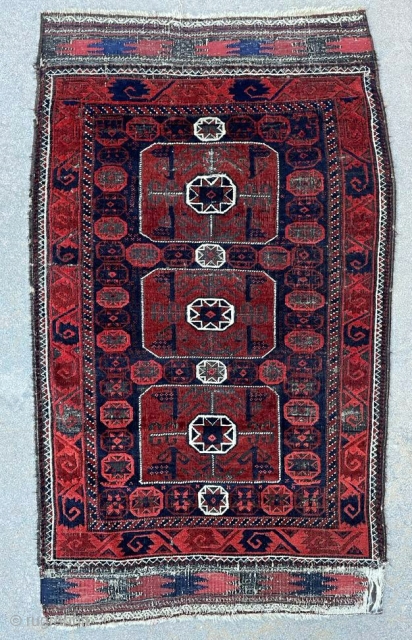 Baluch rug with a field composed of three octagon star bags, a rare design group of Baluch rugs. Most of this type are symmetrically knotted. This is the only asymmetrically knotted type  ...