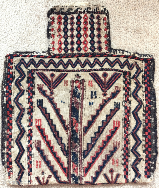 Baluch double-sided sumak salt bag with a design seemingly derived from a Turkmen tentband, one side more worn than the other, still very displayable and graphically powerful, squarish size 45x53cm   